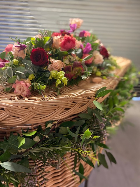 coffin spray and garland